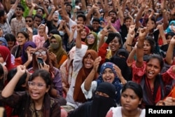 FILE - Students and job seekers shout slogans as they call for a ban on quotas for government jobs, at Shahbagh Square in Dhaka, Bangladesh, July 3, 2024.