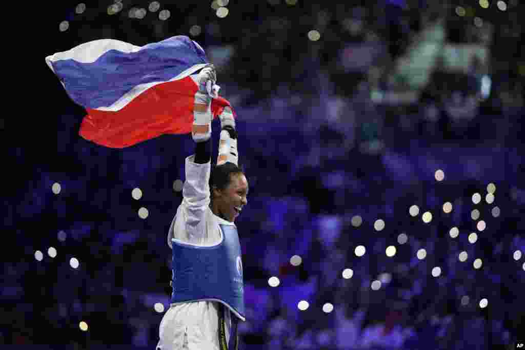 France's Althea Laurin celebrates after winning the women's over 67kg Taekwondo final match against Uzbekistan's Svetlana Osipova during the 2024 Summer Olympics, at the Grand Palais, Aug. 10, 2024, in Paris, France.