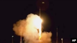 In this photo taken from video released by Roscosmos space corporation, the Soyuz-2.1 rocket booster with Soyuz MS-24 space ship carrying a new crew to the International Space Station blasts off in Baikonur cosmodrome, Kazakhstan, Sept. 15, 2023.
