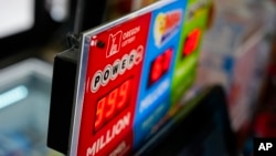 A sign for the Powerball jackpot is displayed at a 7-Eleven, April 5, 2024, in Portland, Oregon. 