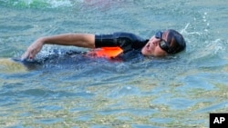 Paris Mayor Anne Hidalgo swims in the Seine river, July 17, 2024 in Paris.