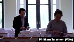 Officers sort received overseas absentee ballots, preparing to pack in diplomatic pouches and send them back to count in Thailand at the Royal Thai Consulate Office in Washington, DC May 3, 2023.