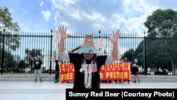National Congress of American Indians president Fawn Sharp prays during protests outside of the White House in support of Leonard Peltier Tuesday, Sept. 12, 2023.