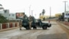 Soldiers of the Republican Guard stand on their armed pick-up in a street in Libreville, Gabon, Aug. 30, 2023.