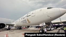 A Singapore airline aircraft is seen on tarmac after requesting an emergency landing at Bangkok's Suvarnabhumi International Airport, Thailand, May 21, 2024.