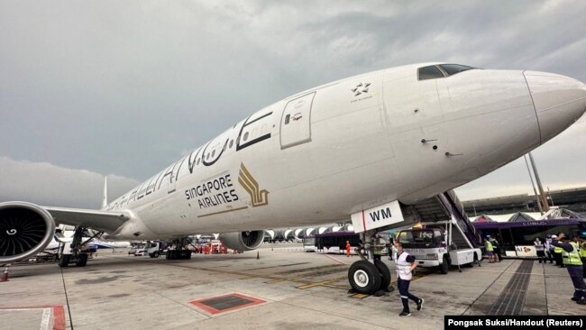 A Singapore airline aircraft is seen on tarmac after requesting an emergency landing at Bangkok's Suvarnabhumi International Airport, Thailand, May 21, 2024.