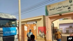 A truck carrying humanitarian assistance from the UN children’s agency stands in front of the Foster Home for Orphans in Khartoum, Sudan, May 2023.