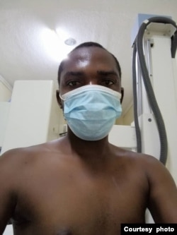 Obert Dube in hospital soon after he was beaten up by police in Victoria Falls. (Photo/Credit: Obert Dube)