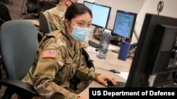 FILE - U.S. Cyber Command Cyber National Mission Force members participate in a training and readiness exercise at Fort George G. Meade, Maryland, on Sept. 27, 2021.