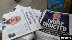 New York newspapers are displayed at a newsstand following former U.S. President Donald Trump's indictment by a Manhattan grand jury following a probe into hush money paid to porn star Stormy Daniels, in New York, March 31, 2023. 