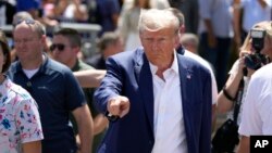 FILE - Republican presidential candidate former President Donald Trump visits the Iowa State Fair, in Des Moines, Iowa, Aug. 12, 2023.