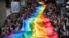 Participants hold a rainbow flag during the Pride Parade in Bangkok, Thailand, June 1, 2024.