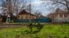 Families bury loved ones in gardens and fields because the cemetery is on the front lines, in Siversk, Ukraine, April 4, 2023. (Yan Boechat/VOA)