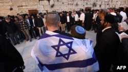 Israelis attend a mass prayer calling for the release of Israeli hostages held in Gaza since the Oct. 7 attacks by Palestinian militants, at the Western Wall in the Old City of Jerusalem on March 21, 2024.