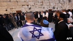 Israelis attend a mass prayer calling for the release of Israeli hostages held in Gaza since the Oct. 7 attacks by Palestinian militants, at the Western Wall in the Old City of Jerusalem on March 21, 2024.