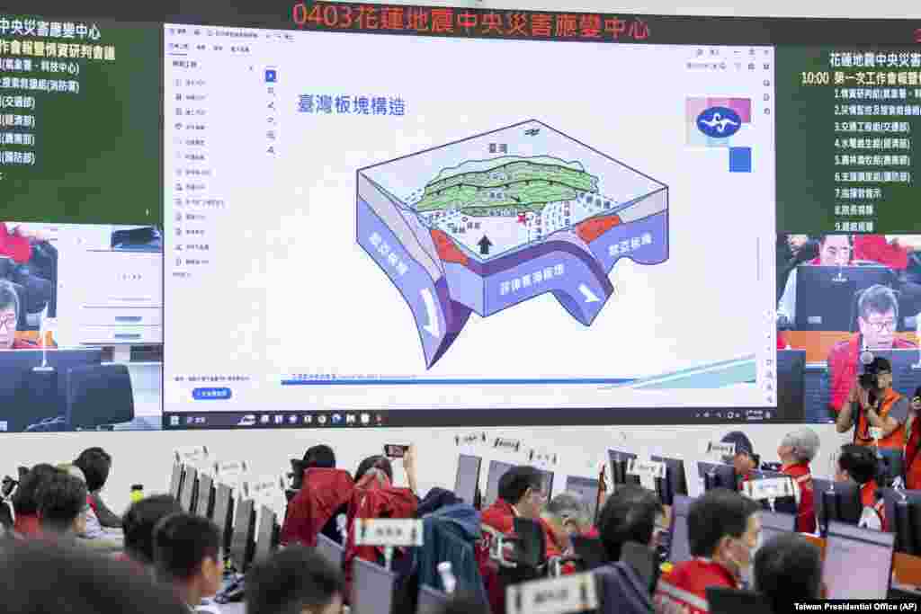 A diagram depicting the tectonic plates below Taiwan is displayed on screen during a visit by Taiwan's President Tsai Ing-wen, unseen, to the Central Emergency Operation Center in New Taipei City in Taiwan, April 3, 2024. 