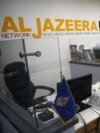 FILES - An employee of the Qatar-based news network and TV channel Al-Jazeera is seen at the channel's Jerusalem office, July 31, 2017. Israel's Prime Minister said on May 5, 2024, that his government has decided to shut down Al Jazeera.