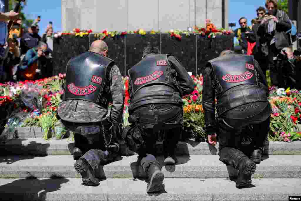 Members of the motorcycling club &quot;Night Wolves&quot; lay flowers to mark Victory Day and the 78th anniversary of the end of World War II in Europe, at the Soviet War Memorial in Tiergarten Park, Berlin, Germany.