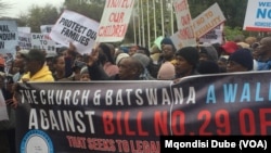 Scores march through the streets of Gaborone, Botswana, protesting against the bill that if passed would decriminalize same-sex relations.