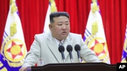 FILE - In this photo provided by the North Korean government, North Korean leader Kim Jong Un speaks during his visit to the navy headquarters in North Korea, on Aug. 27, 2023.