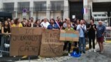 Protesters hold placards reading "Here, journalist in jail" and "Information behind bars" as they demonstrate in front of police headquarters in Marseille, France, Sept. 20, 2023, in support of jailed journalist Ariane Lavrilleux.
