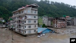 Buildings are inundated after flash floods triggered by a sudden heavy rainfall swamped the Rangpo town in Sikkim, India, Oct.5. 2023.