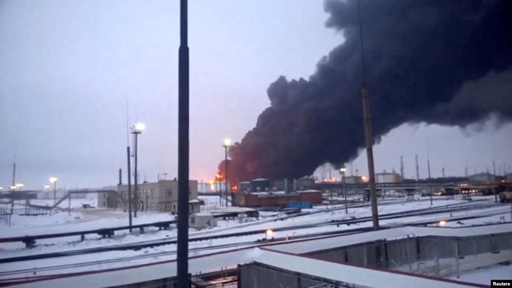 Smoke billows after Ukrainian drones strike a refinery, amid Russia's invasion of Ukraine, in Ryazan, Russia, in this screen grab from video obtained by Reuters, March 13, 2024.