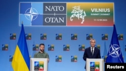 FILE - NATO Secretary General Jens Stoltenberg, right, and Ukraine's President Volodymyr Zelenskyy address a media conference during a NATO summit in Vilnius, Lithuania, July 12, 2023.