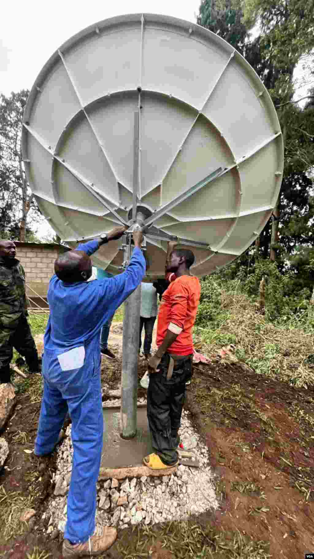 Final adjustments are made to satellite equipment before the launch of the new VOA radio station serving the Kirongi district in Rwanda.