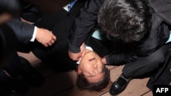South Korean opposition party leader Lee Jae-myung is attended to after being attacked in Busan, Jan. 2, 2024. 