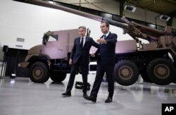 U.S. Secretary of State Antony Blinken, left, and French Defence Minister Sebastien Lecornu attend the French Support for Ukraine Public Diplomacy Event at the Nexter Systems headquarters in Versailles, near Paris, France, April 2, 2024.
