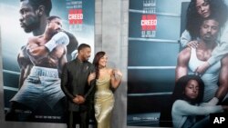 FILE - Michael B. Jordan, left, and Tessa Thompson arrive at the premiere of "Creed III" on at TCL Chinese Theatre in Los Angeles, Feb. 27, 2023. (Photo by Jordan Strauss/Invision/AP)