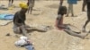 Famílias desenterram arroz de aterro sanitário em Benguela, Angola