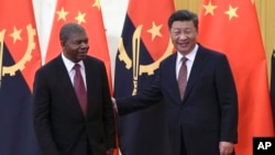 FILE - Angola's President Joao Lourenco and Chinese President Xi Jinping prepare for their bilateral meeting at the Great Hall of the People in Beijing, Sunday, Sept. 2, 2018. 