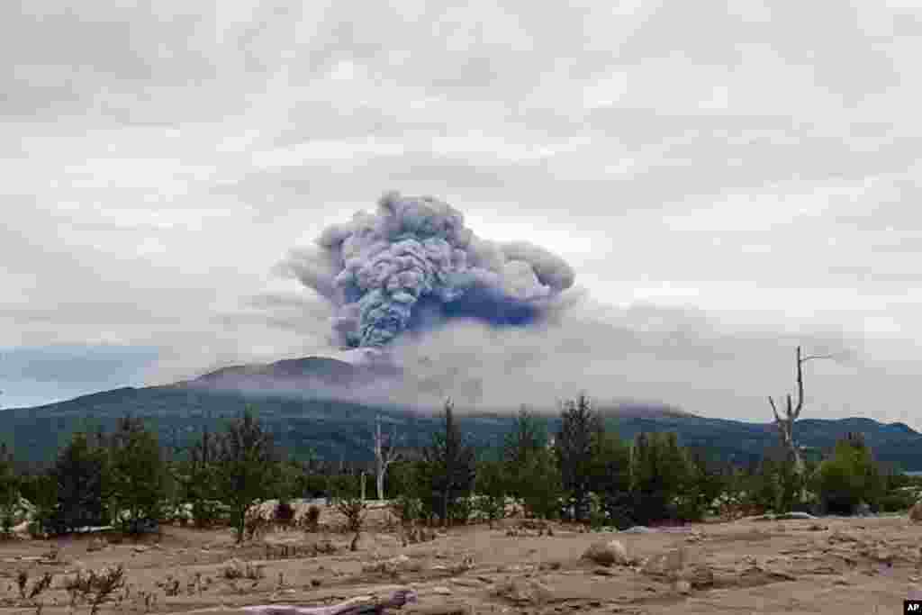 In this photo taken from AP video, provided by by the Institute of Volcanology and Seismology of the Far Eastern Branch of the Russian Academy of Sciences, the eruption of the Shiveluch volcano is seen on Russia&#39;s Kamchatka Peninsula.