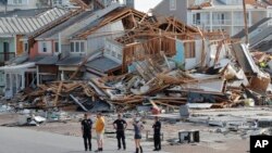 FILE - Rescue personnel perform a search in the aftermath of Hurricane Michael in Mexico Beach, Fla., Oct. 11, 2018