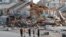 FILE - Rescue personnel perform a search in the aftermath of Hurricane Michael in Mexico Beach, Fla., Oct. 11, 2018