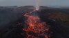 Lava merah membara tampak menyembur dari gunung berapi yang meletus di dekat kota Grindavik, Islandia. (AP)&nbsp;