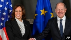 U.S. Vice President Kamala Harris, left, and German Chancellor Olaf Scholz, right, shake hands prior to a bilateral meeting at the Munich Security Conference in Munich, Germany, Feb. 17, 2023.
