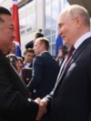 In this photo distributed by Sputnik agency, Russia's President Vladimir Putin (R) shakes hands with North Korea's leader Kim Jong Un (L) during their meeting at the Vostochny Cosmodrome in Amur region on Sept. 13, 2023.