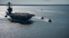 FILE - In this photo provided by the U.S. Navy, the USS Gerald R. Ford embarks on its first sea trial from Newport News, Virginia, April 8, 2017. (Mass Communication Specialist 2nd Class Ridge Leoni/U.S. Navy via AP)