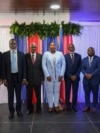 Haiti's transitional council members pose for a group photo after a ceremony to name its president and a prime minister, in Port-au-Prince, Haiti, April 30, 2024.