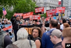 People react to the guilty verdict announced against former President Donald Trump outside Manhattan Criminal Court, May 30, 2024, in New York.