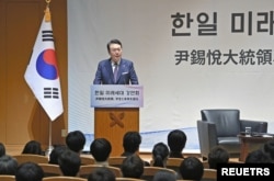 South Korea's President Yoon Suk Yeol delivers a speech to students at Keio University in Tokyo, Japan March 17, 2023, in this photo released by Kyodo.
