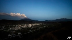 The Popocatepetl volcano spews ash and steam during an eruption seen from Santiago Xalitzintla, Mexico, May 25, 2023.