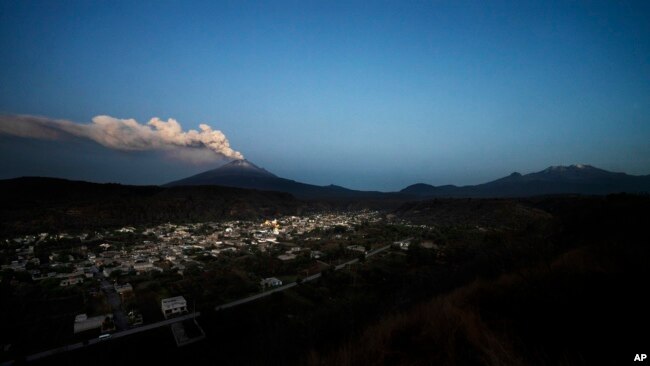 The Popocatepetl volcano spews ash and steam during an eruption seen from Santiago Xalitzintla, Mexico, May 25, 2023.