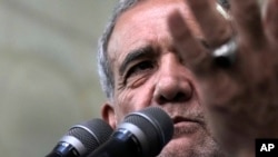 Iran's President-elect Masoud Pezeshkian speaks in a meeting a day after the presidential election, at the shrine of the late revolutionary founder Ayatollah Khomeini, just outside Tehran, Iran, July 6, 2024. 