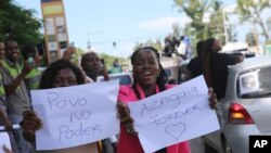 Protesters take part in a march supporting rapper Azagaia in Maputo, Mozambique, March 15, 2023.