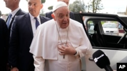 Pope Francis talks with journalists as he leaves the Agostino Gemelli University Hospital in Rome, April 1, 2023 after receiving treatment for bronchitis.