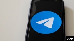 file - This illustration picture taken on Aug. 16, 2019 in Paris shows a smartphone showing the Telegram app logo.